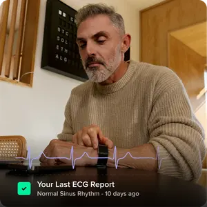 Man wearing Whoop MG with ECG report overlay