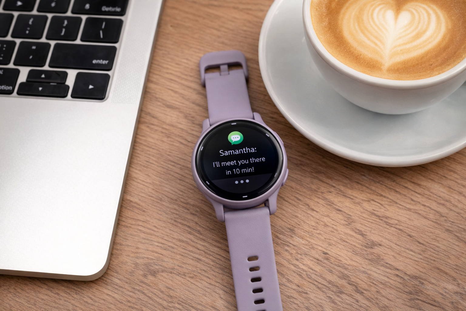 Garmin Vivoactive 5 on a desk beside a laptop, showing smart notifications in daily use