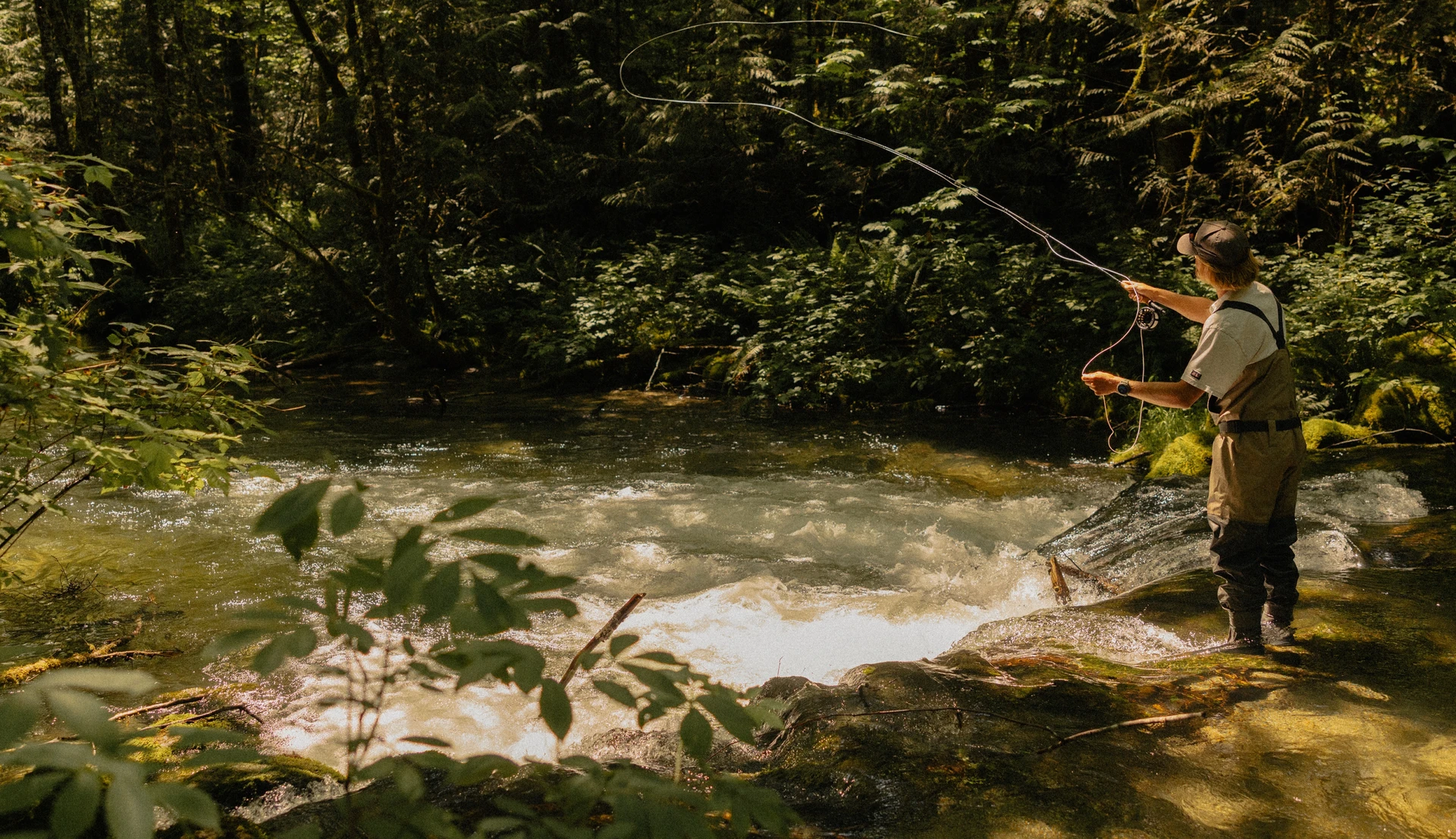 Fly fishing in a mountain stream with the Coros Nomad