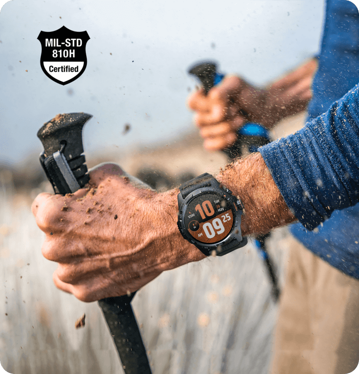 TicWatch Atlas worn on wrist during muddy outdoor hike showing rugged durability
