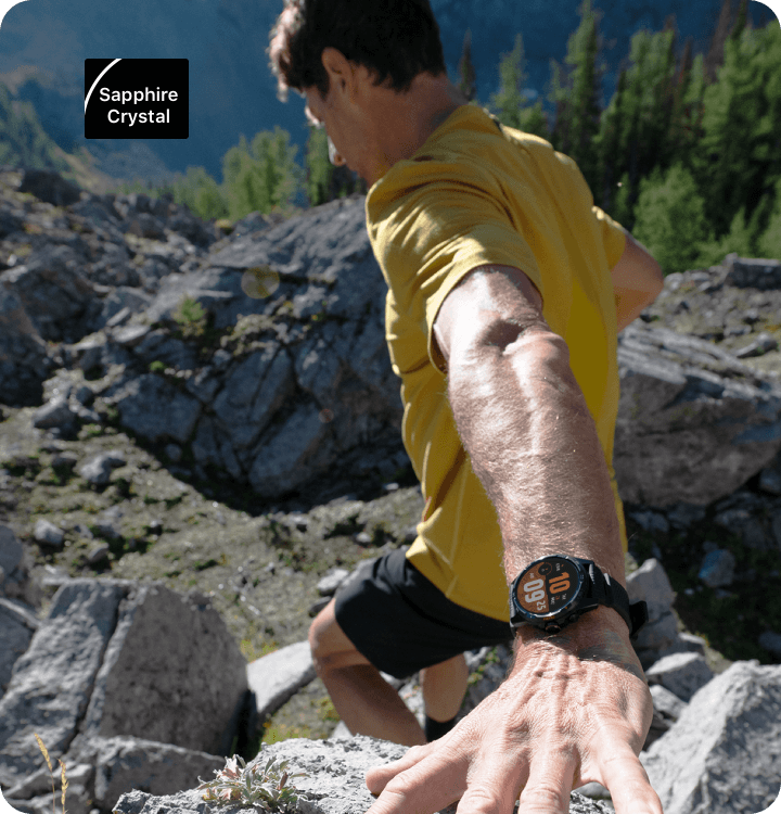 Trail runner navigating rocky mountain terrain wearing the TicWatch Atlas