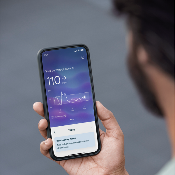 A man checks his real-time glucose reading in the Lingo app