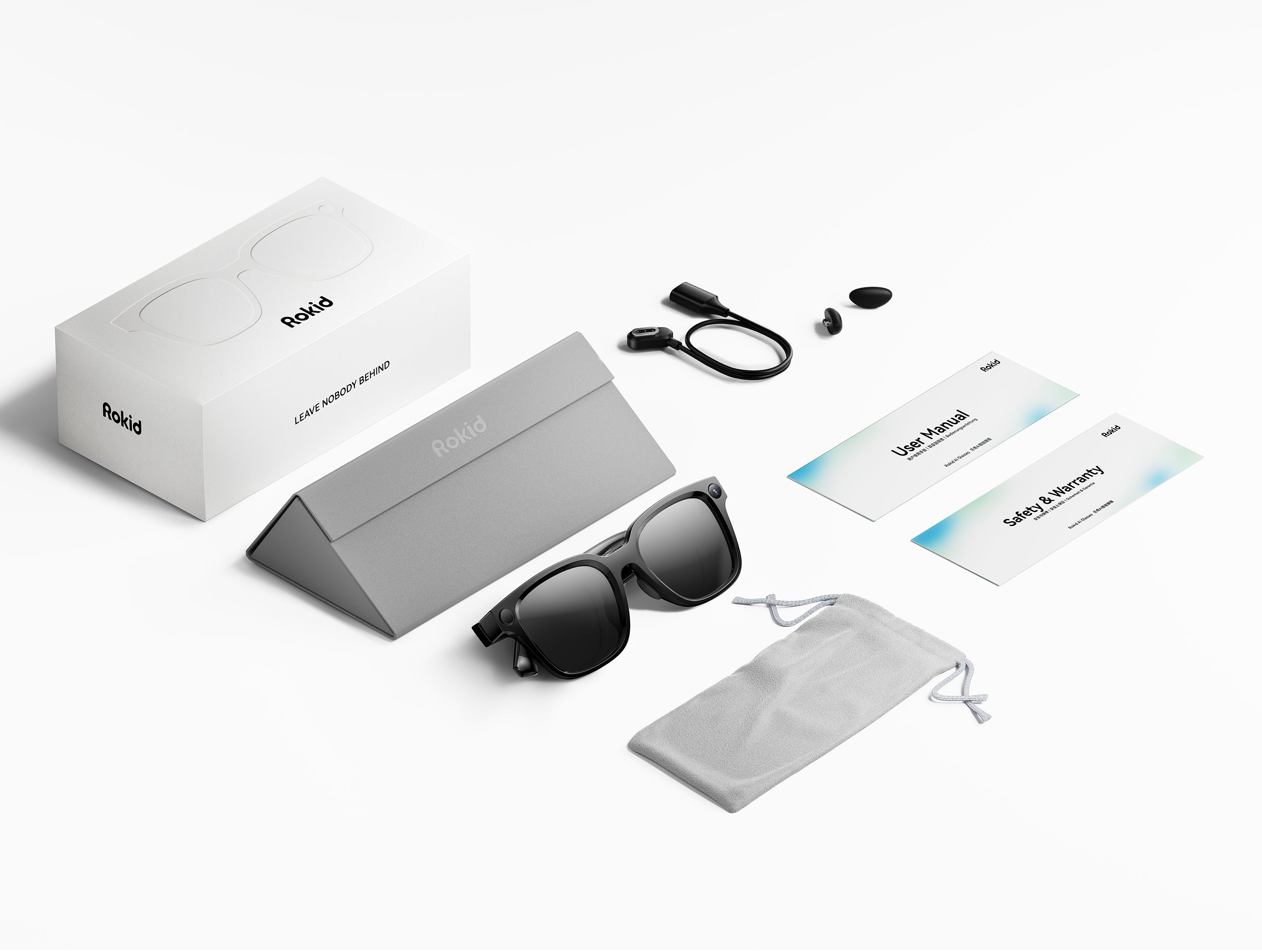 Rokid AI Glasses Style box contents including carry case, magnetic charging cable and cleaning pouch