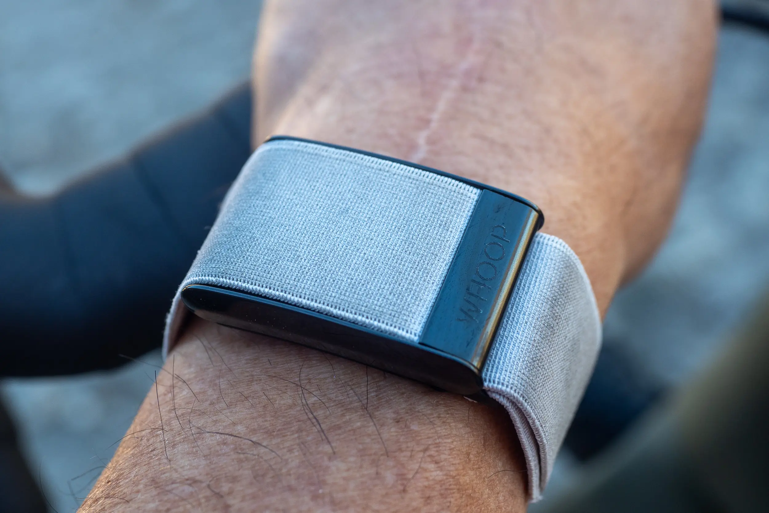 WHOOP 4.0 close-up on wrist with grey SuperKnit band